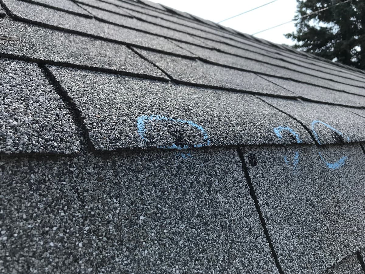 Hail impact markings near roof details
