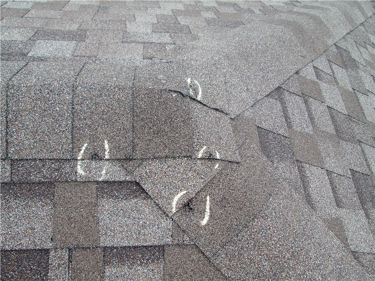 Hail damage inspection on an asphalt shingle roof in Fort Worth