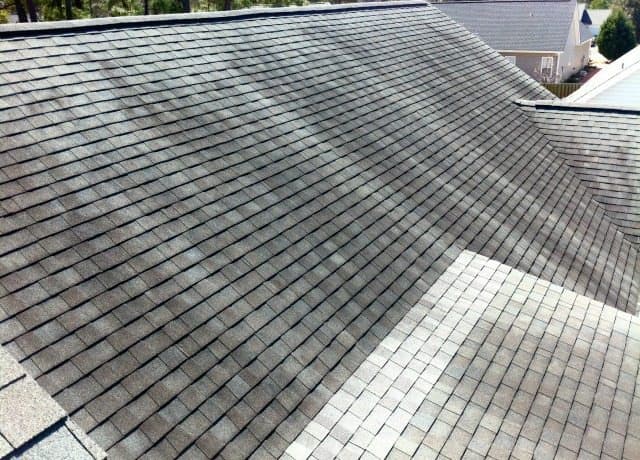 Residential shingle roof valley checked for possible leak entry points